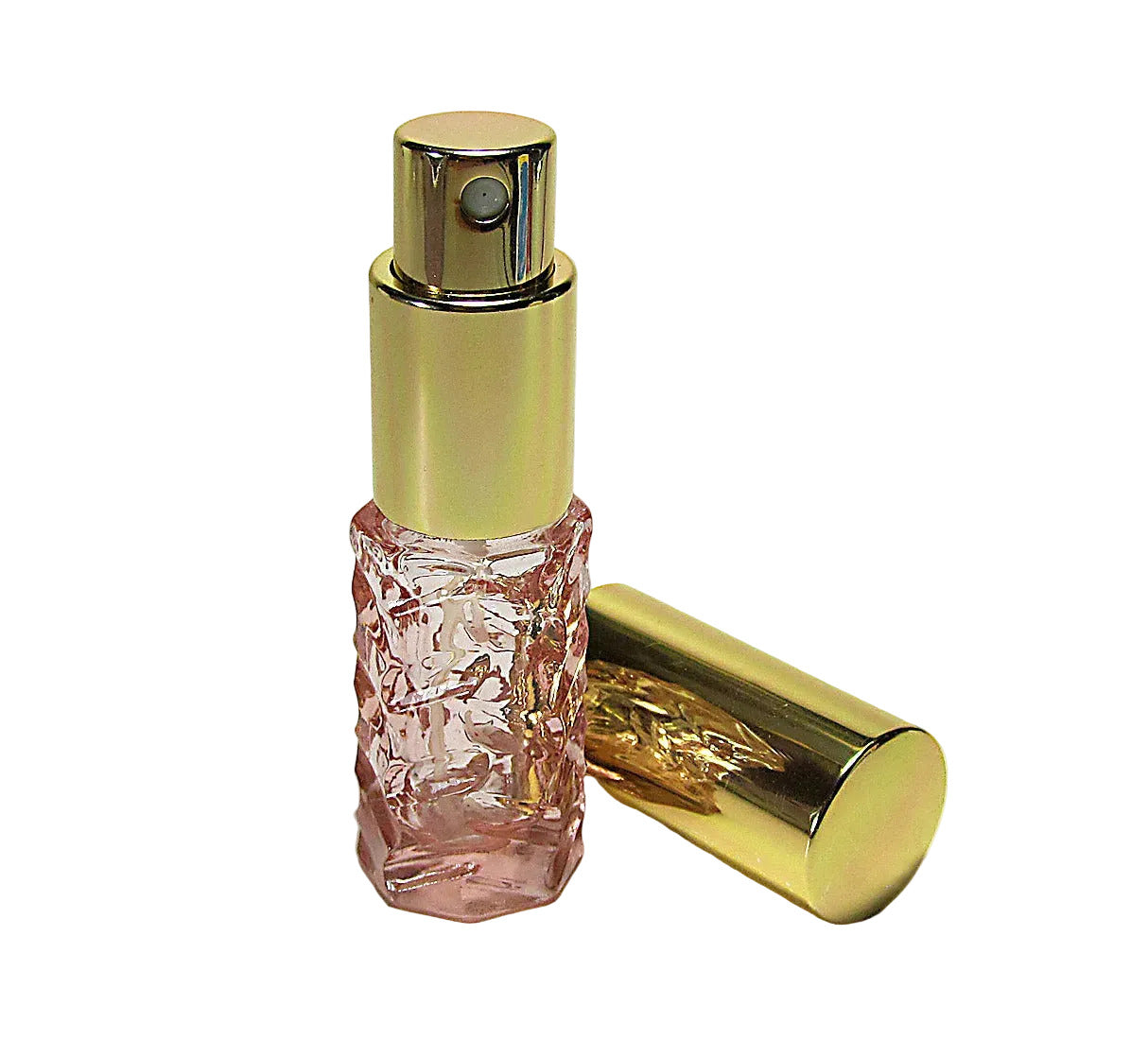 Pink perfume bottle with gold cap on a white background