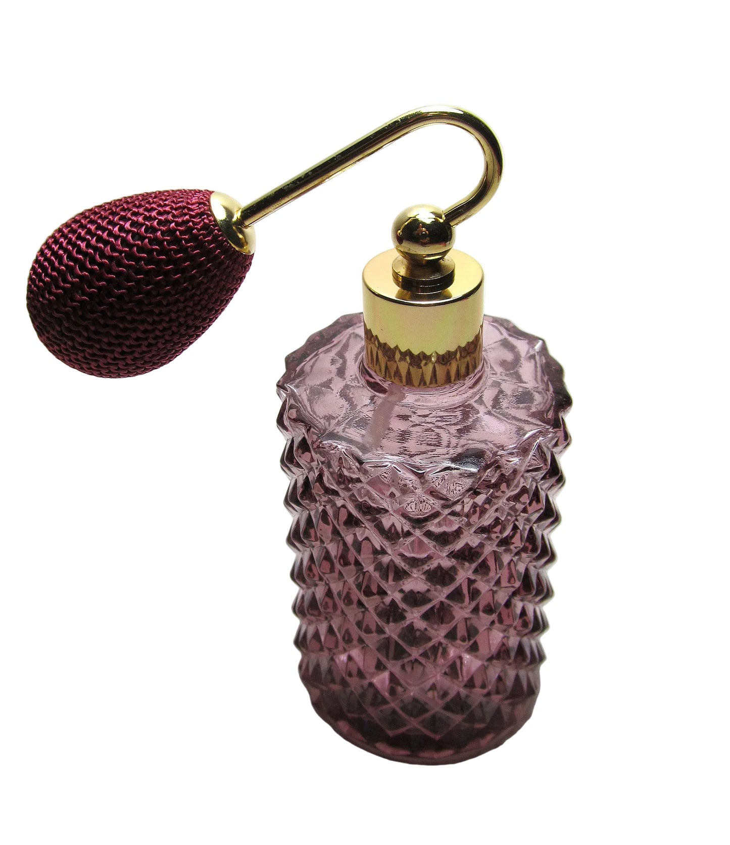 Pink glass perfume bottle with a gold cap and red spray nozzle on a white background