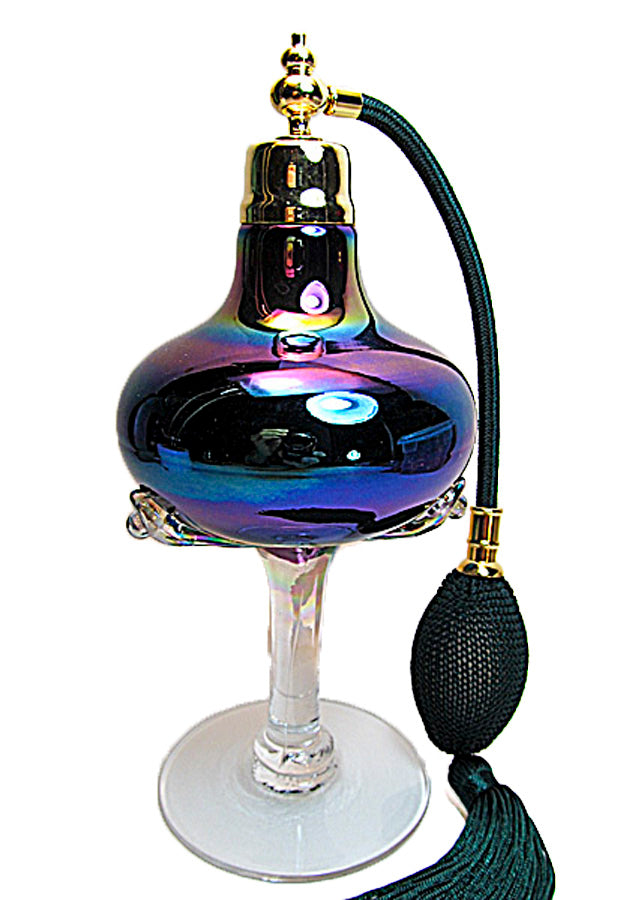 Art made with mouth blew perfume bottle with dark green tassel spray mounting.