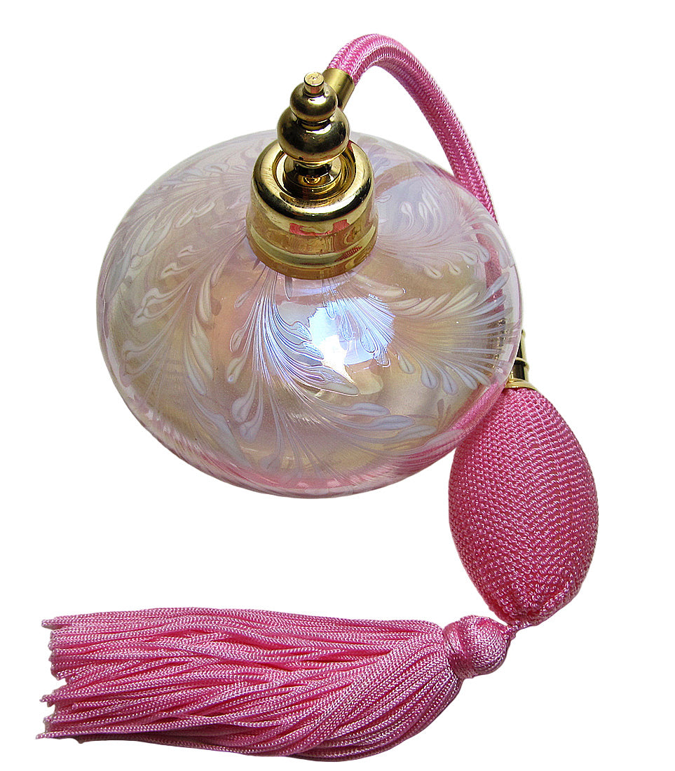 Decorative perfume bottle with pink tassel