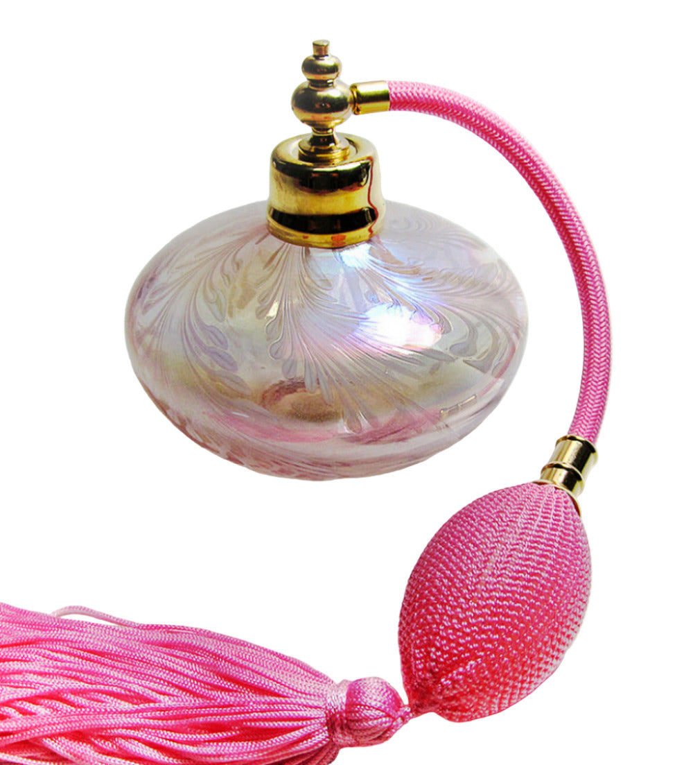 Perfume bottle with pink tasse
