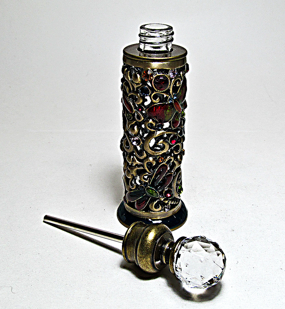 Antique perfume bottle with crystal cap and rod.