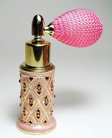 Antique perfume bottle with pink bulb spray mounting.