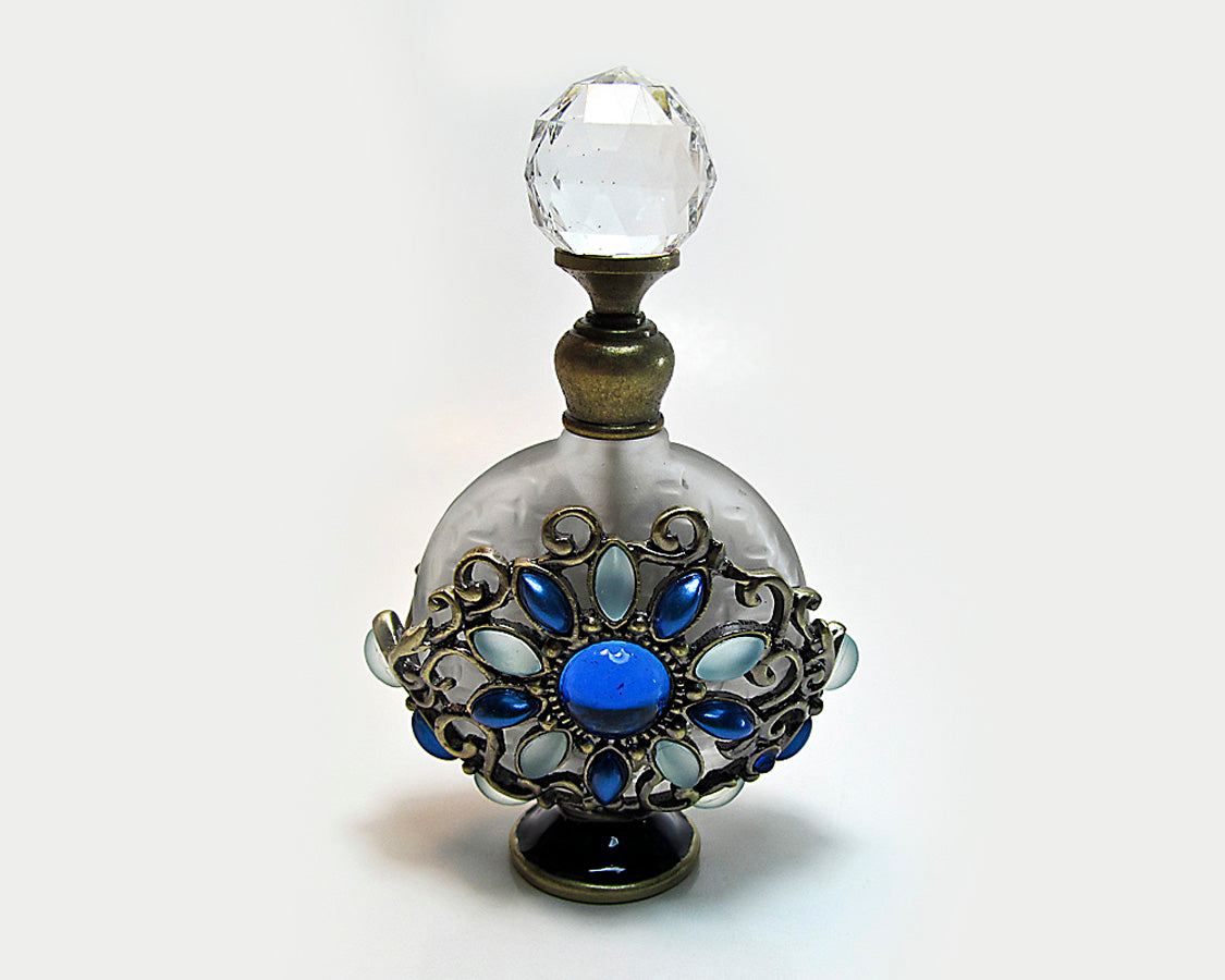 Antique perfume bottle with crystal screw cap and rod.