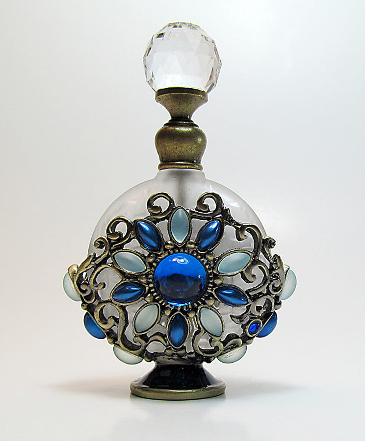 Antique perfume bottle with crystal screw cap and rod.