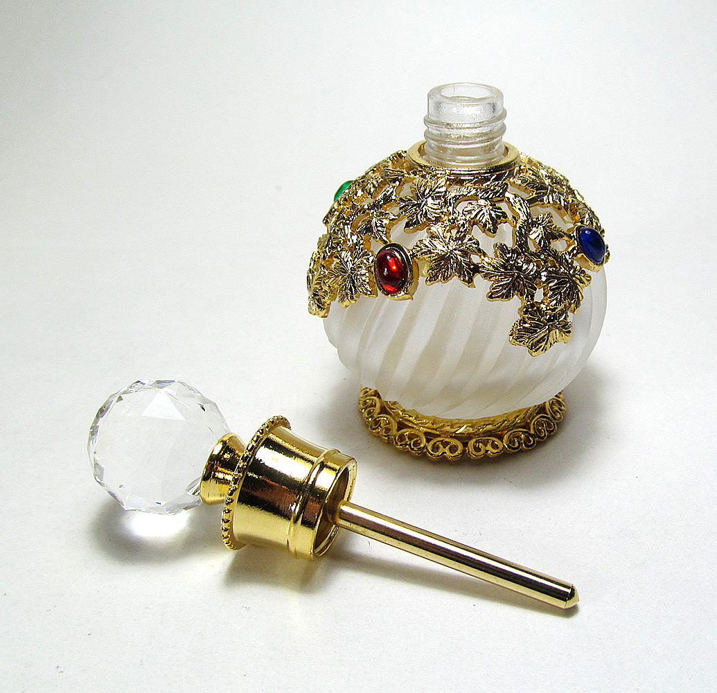 Antique perfume bottle with crystal screw cap and rod.