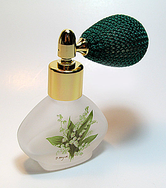 Floral perfume bottle with bulb spray attachment.