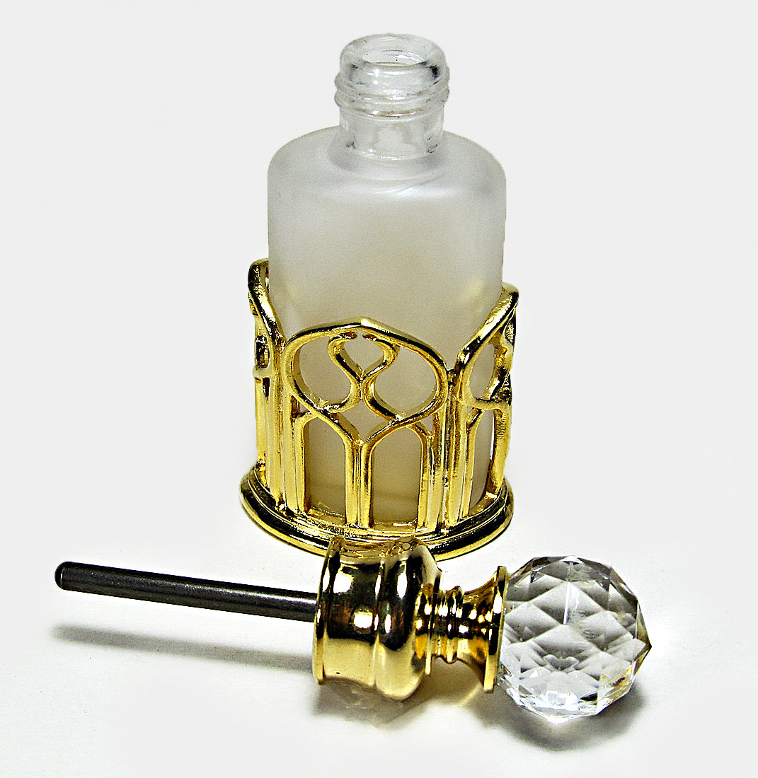 Antique perfume bottle with crystal cap and rod.