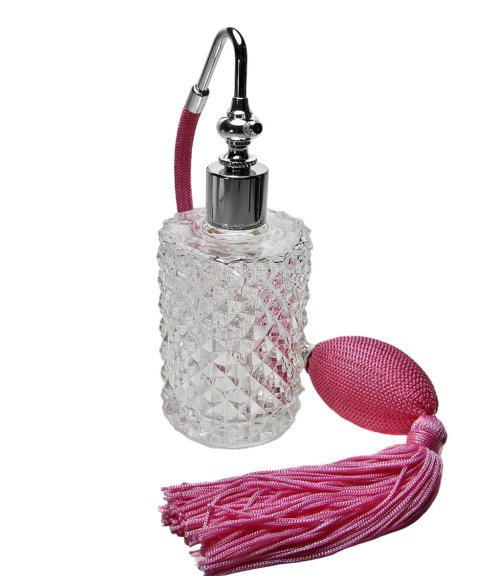 Decorative bottle with pink tassel on a white background