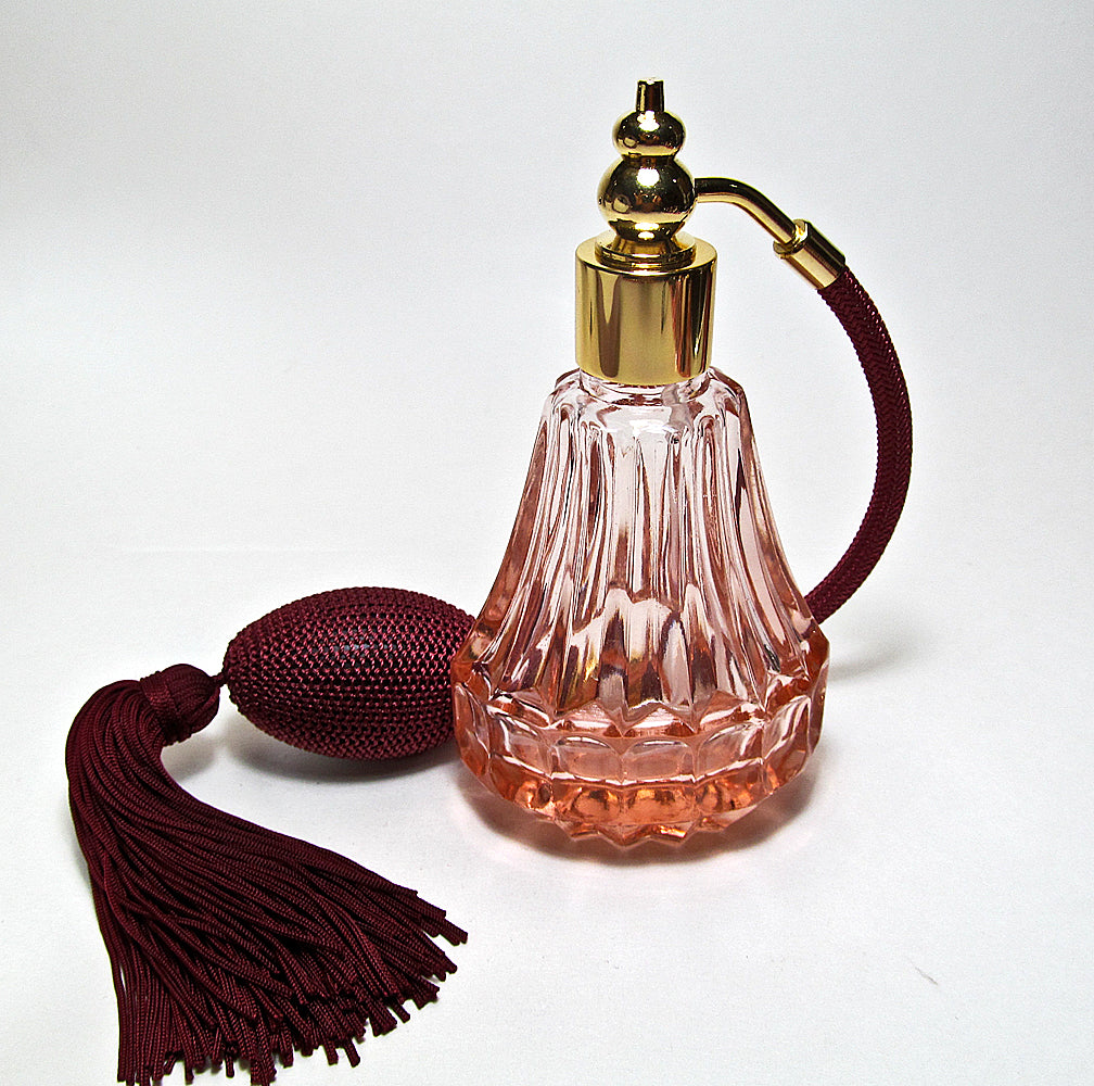 Light Red Crystal Glass Perfume Bottle With Burgundy Tassel Spray Mounting.