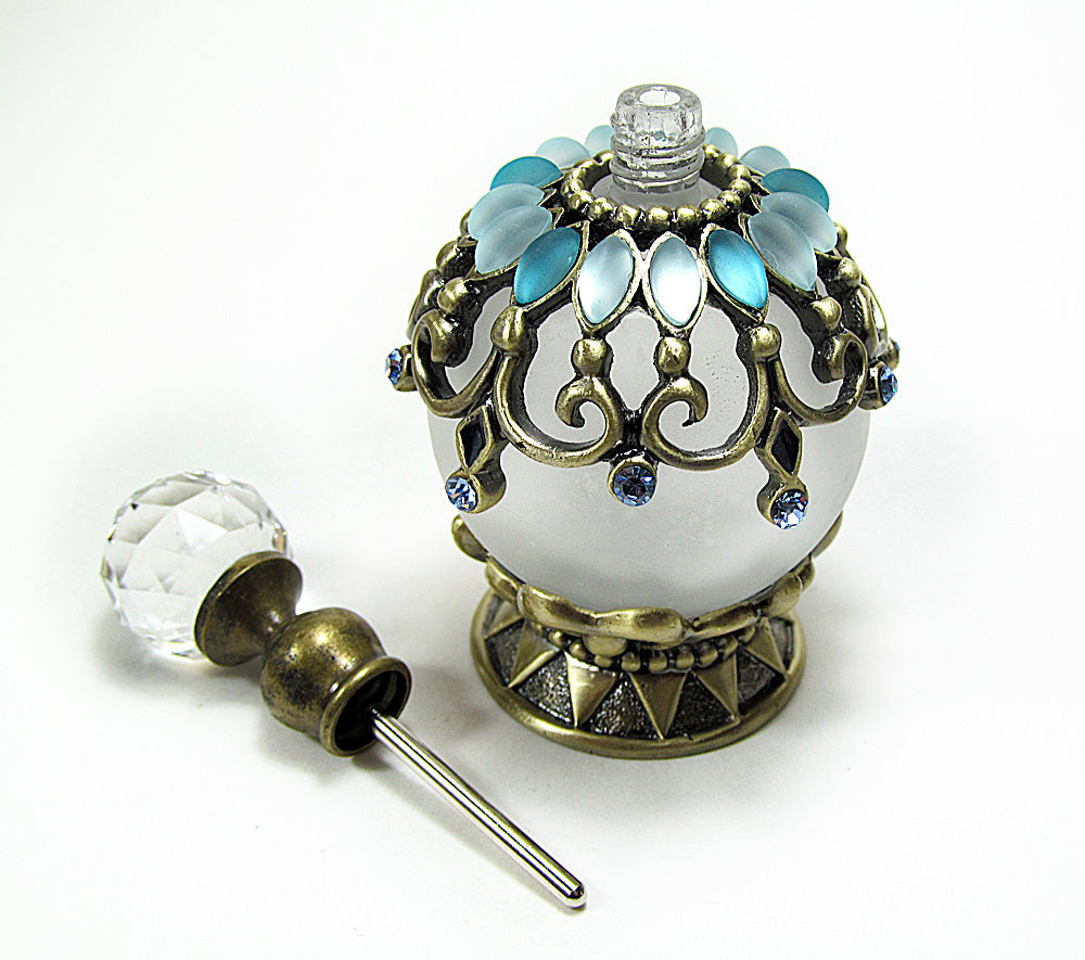 Antique perfume bottle with crystal screw cap and rod.