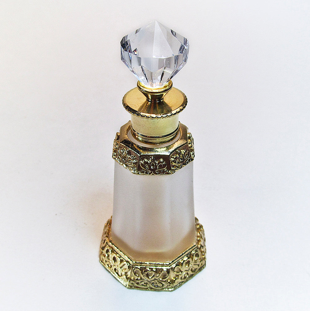 Antique perfume bottle with crystal cap and rod.