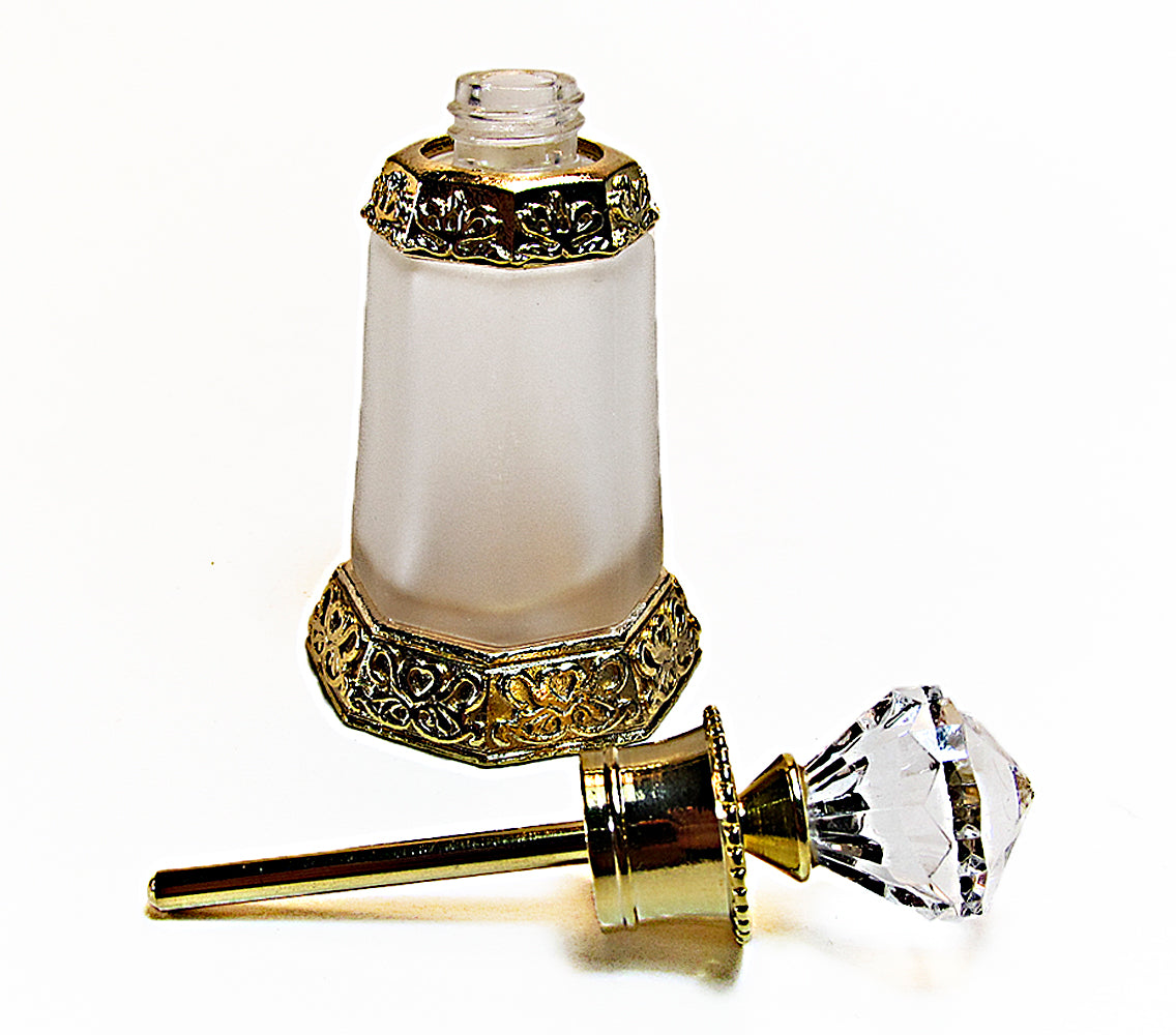 Antique perfume bottle with crystal cap and rod.