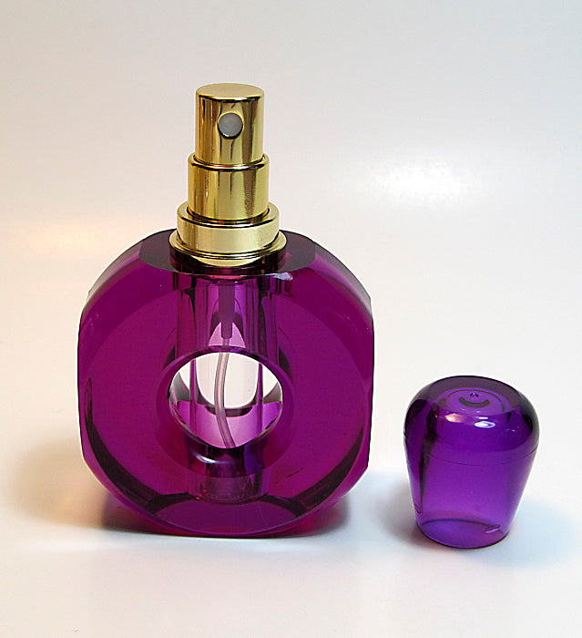 Empty perfume bottle and atomizer