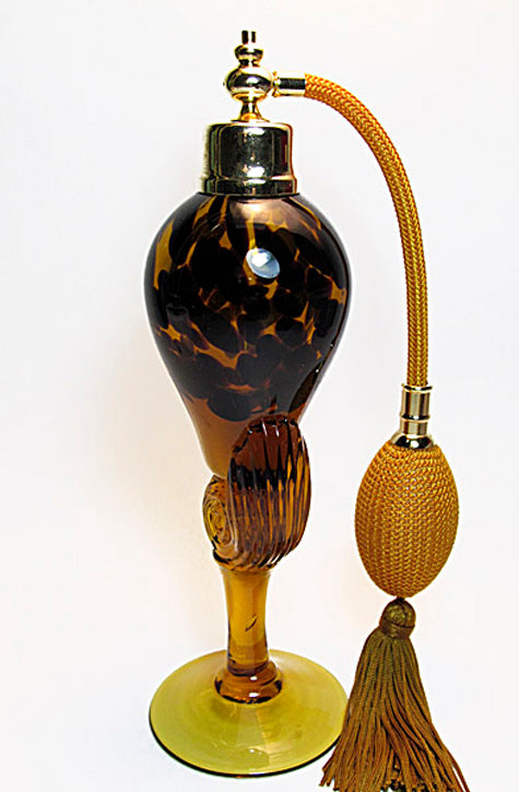 Art crystal glass perfume bottle with brown gold bulb and tassel spray mounting.