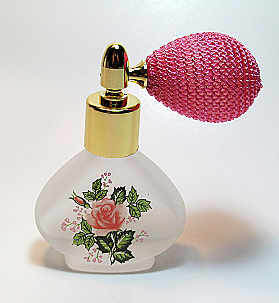Floral perfume bottle with bulb spray attachment.
