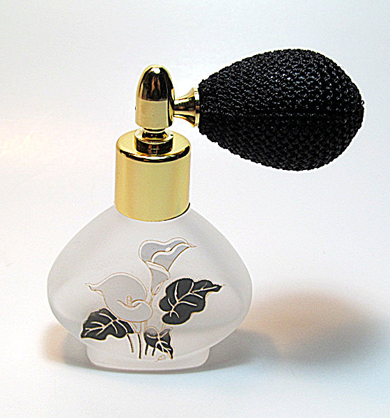 Floral perfume bottle with bulb spray attachment.
