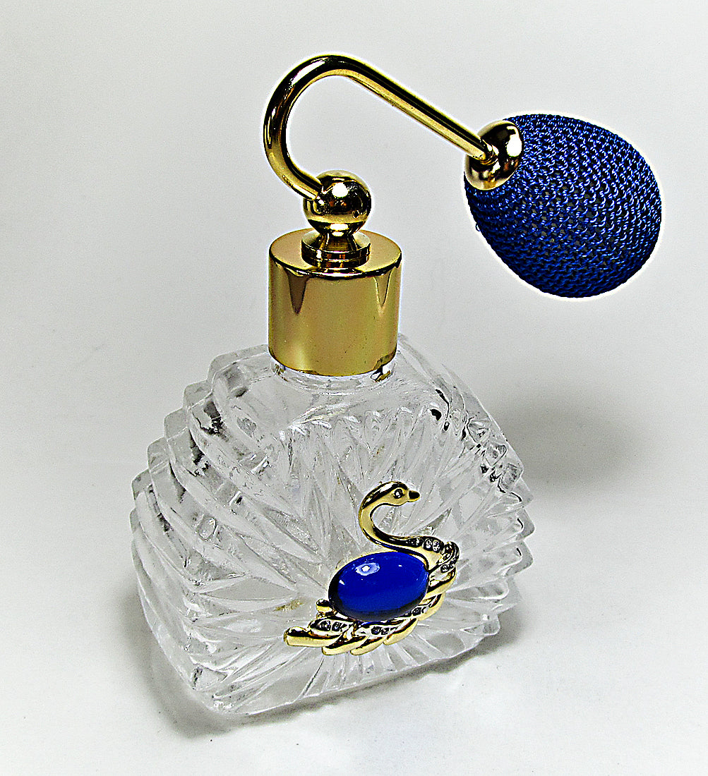 Decorative perfume bottle with gold and blue accents on a white background
