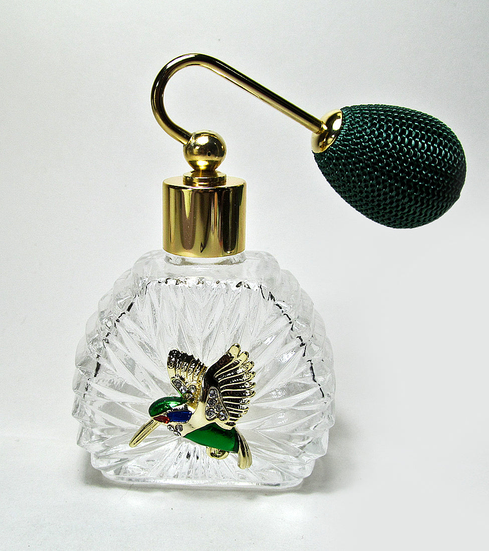 Unique vintage perfume spray bottle with green bulb spray attachment.