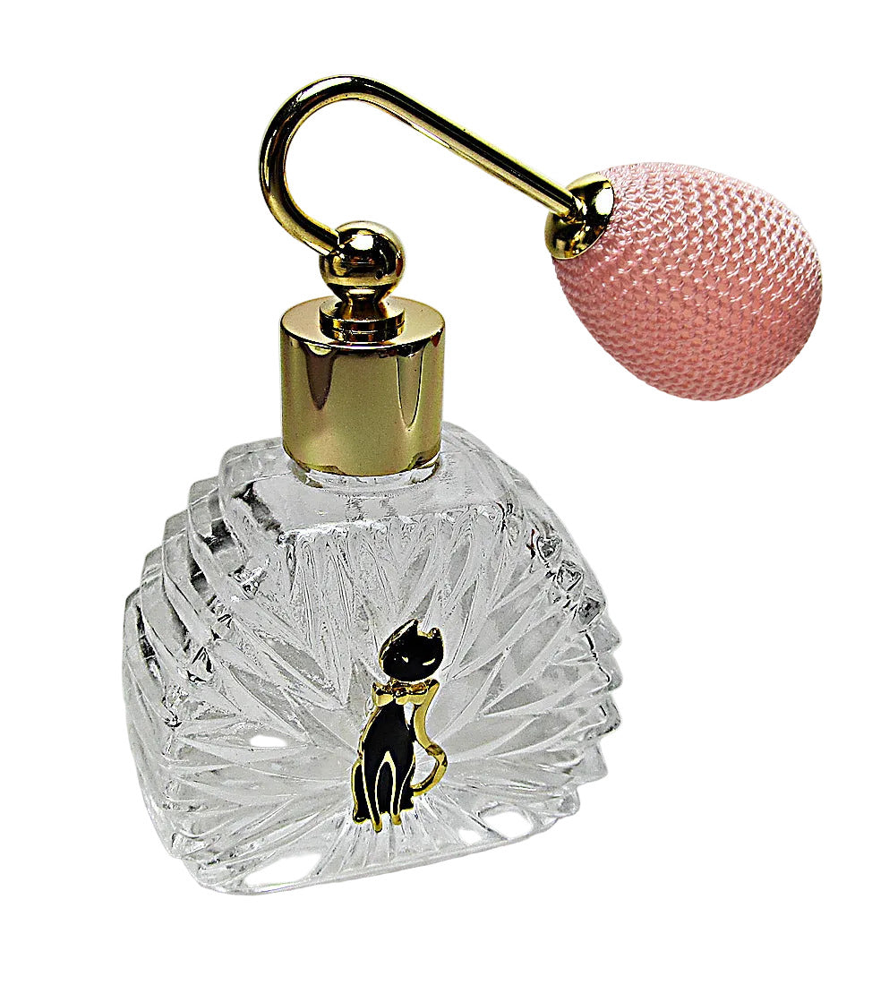 Clear glass perfume bottle with gold cap and pink ball on a white background